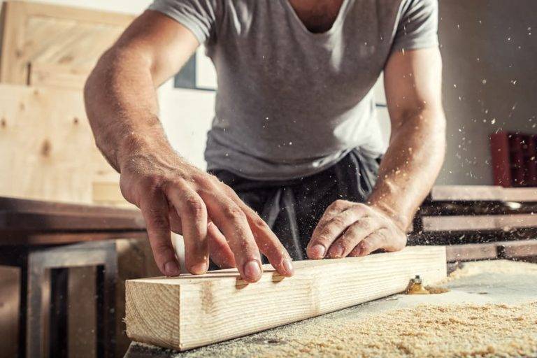 man working with wood